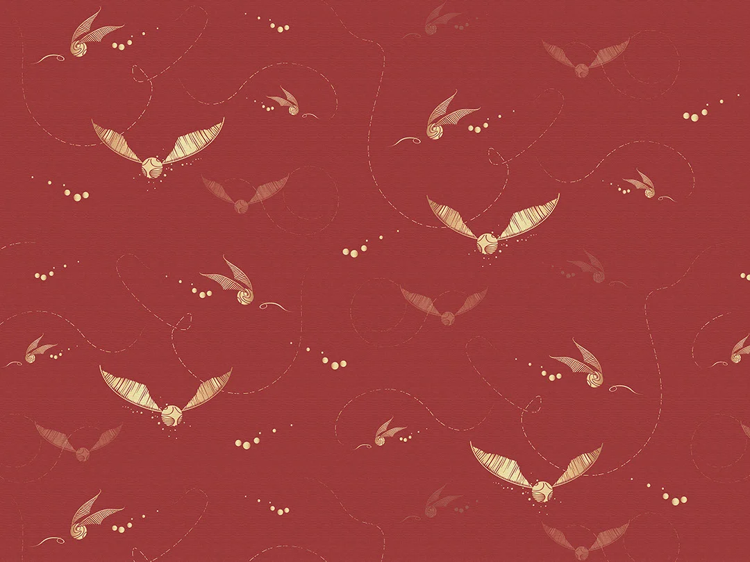 Designer wallpaper with pattern of golden Harry Potter snitches on the red background