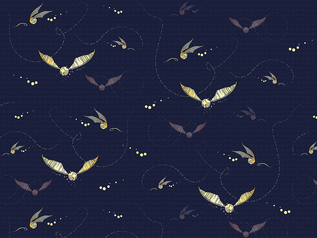 Designer wallpaper with pattern of golden Harry Potter snitches on the navy blue background