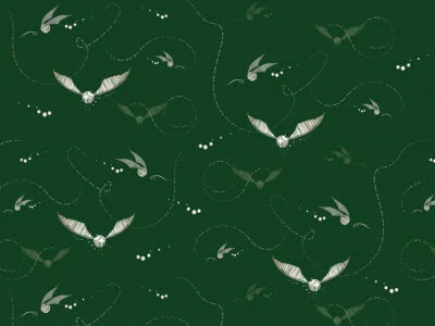 Designer wallpaper with pattern of white Harry Potter snitches on the green background