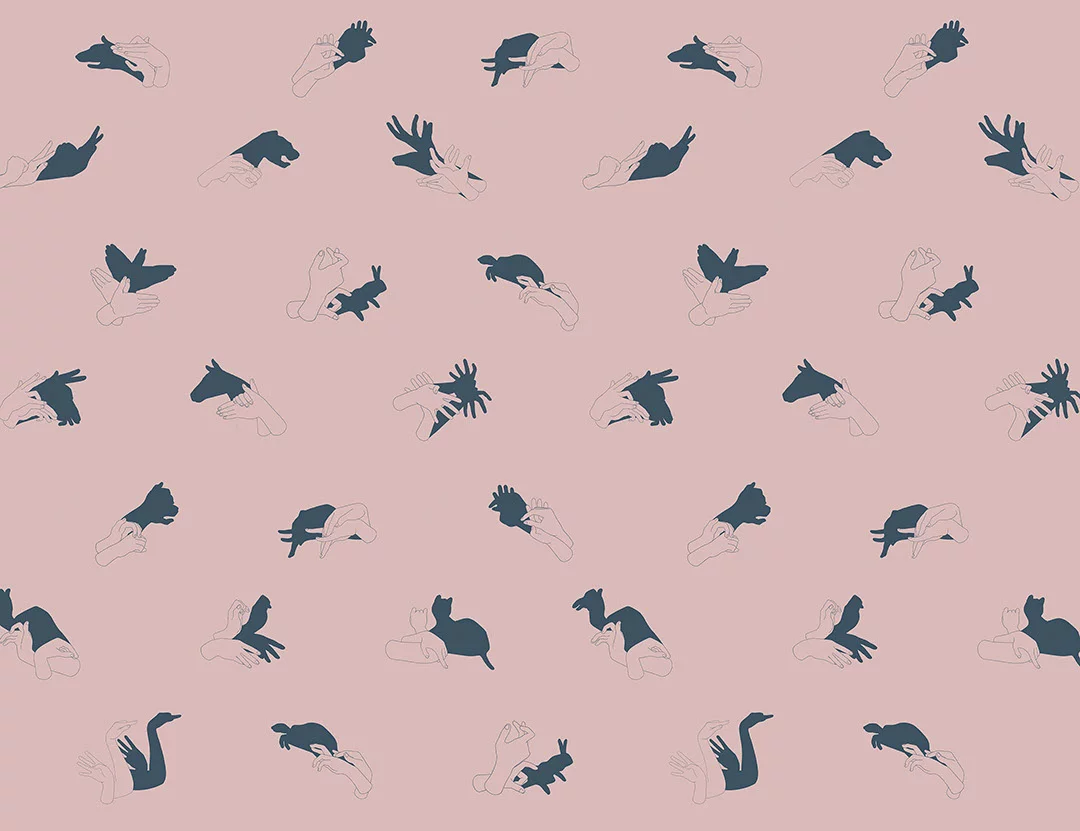 Patterned interactive pink wall mural with hand shadow signs