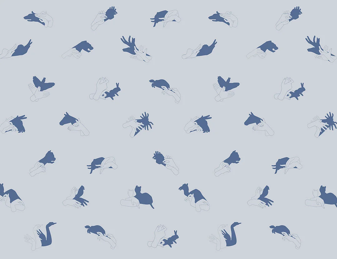 Patterned interactive blue wall mural with hand shadow signs